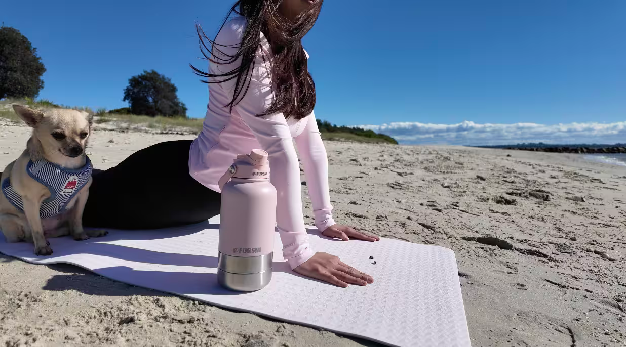 Dog enjoying the Furshi 3-in-1 water bottle